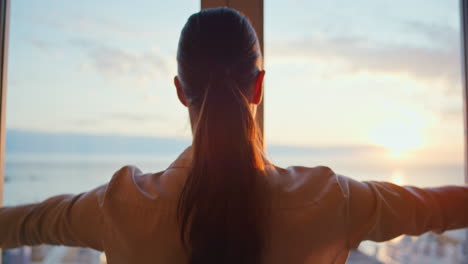 Curtain,-window-and-view-with-a-woman-opening