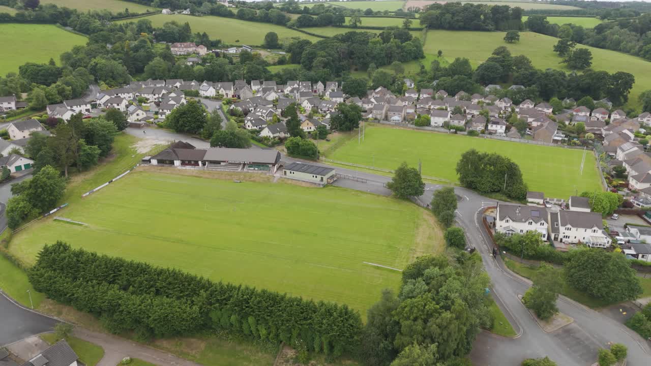 Aerial view of Okehampton RFC pitch in Okehampton Devon UK, showing rugby field and surrounding area