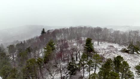 snow falling on mountain slope in appalachia near boone nc
