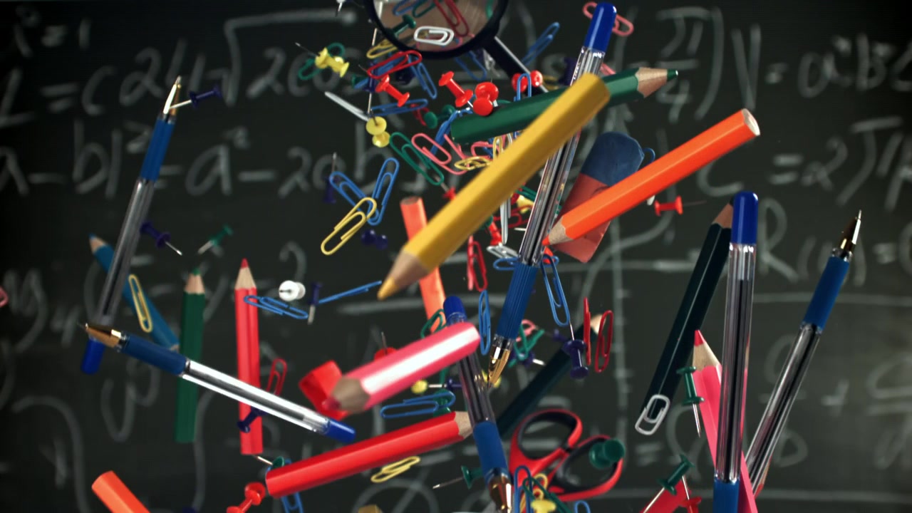 Colorful School and Office Supplies Floating Against a Math Chalkboard