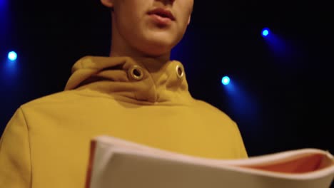 teenagers rehearsing in a theatre