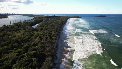 waves splashing at dreamtime beach in fingal head, nsw, australia - drone shot