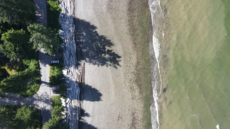 Top-down-drone-footage-of-a-typical-beach-at-the-rocky-shore-in-the-pacific-north-west-of-Canada