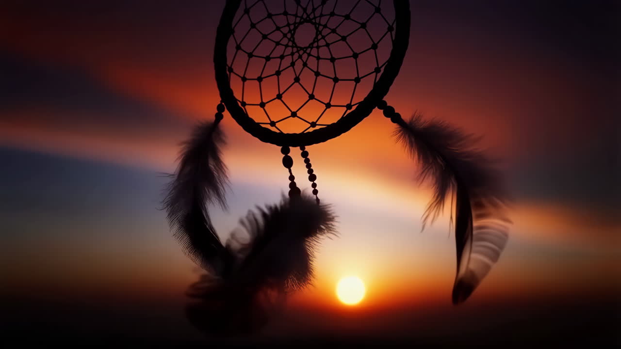 Dreamcatcher Silhouette Against Vibrant Sunset Sky