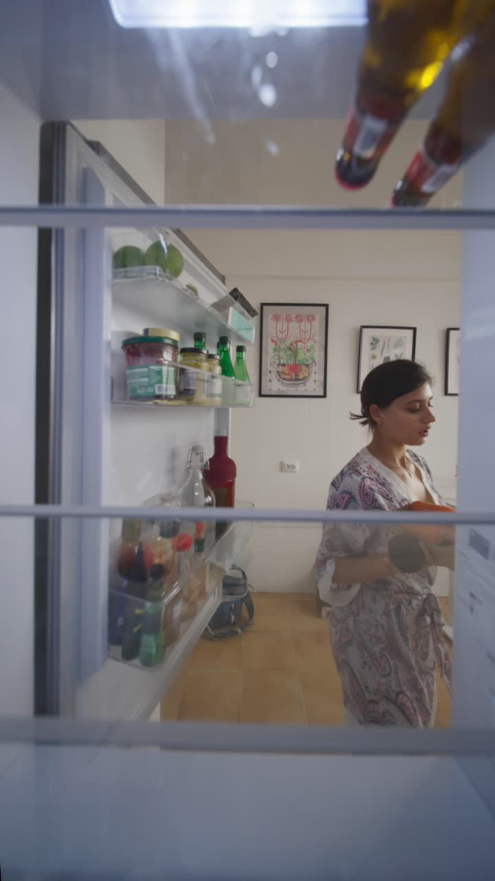 Woman Taking a Late Night Snack