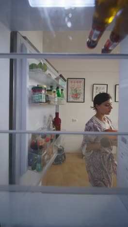 woman taking a late night snack