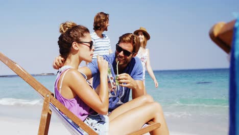 Couple-enjoying-together-at-beach