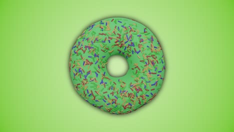 delicioso verde colorido esmaltado y salpicado rosquilla girando en fondo verde abstracto