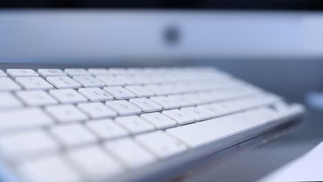 hands of a male worker typing