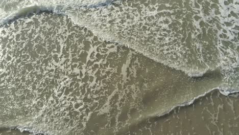 cinematic north sea surf filmed from above following the waves