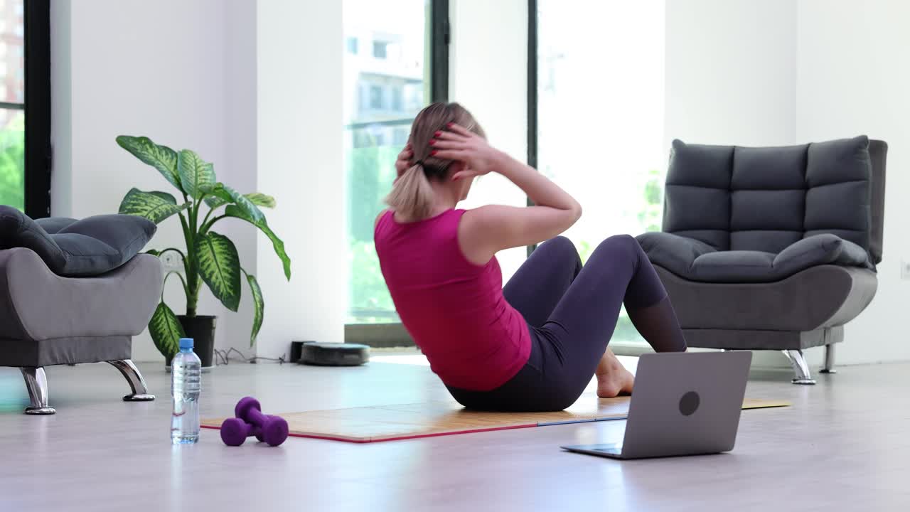 Woman doing sit-ups at home