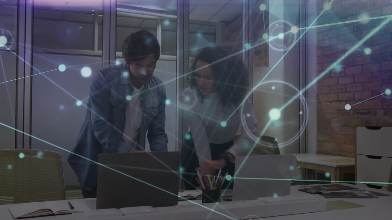 Animation of network of connections over diverse colleagues using laptops in office