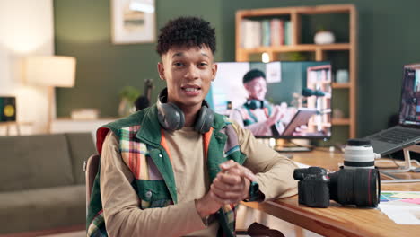man filming a vlog at his desk