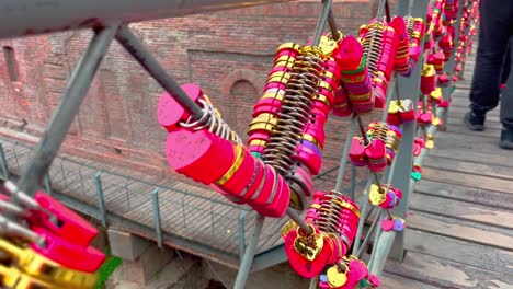 Red-padlocks-hanging-on-the-bridge