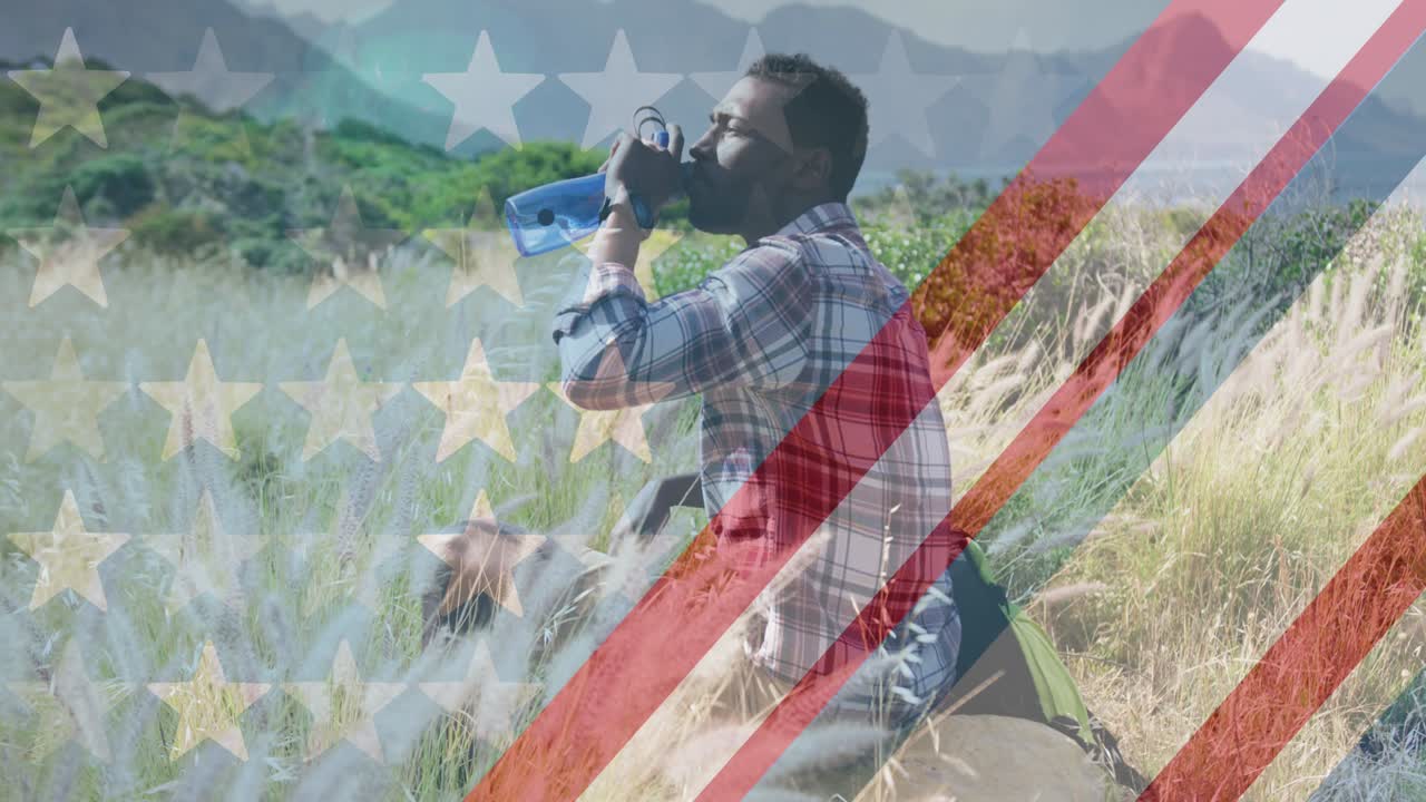 산에서 물을 마시는 아프리카계 미국인 남성 위에 있는 미국 국기의 애니메이션