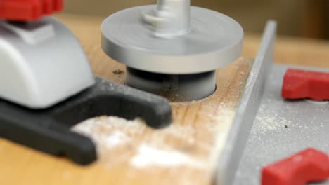 circular hole saw drill bit in action, close-up