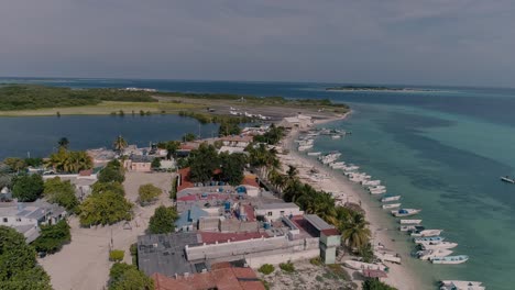 landscape fishing village caribbean sea island, drone shot dolly out los roques