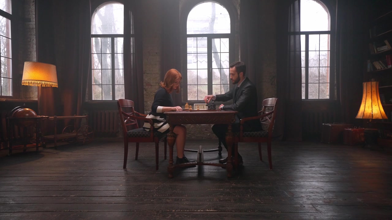 Man and Woman Playing Chess in a Vintage Library Room