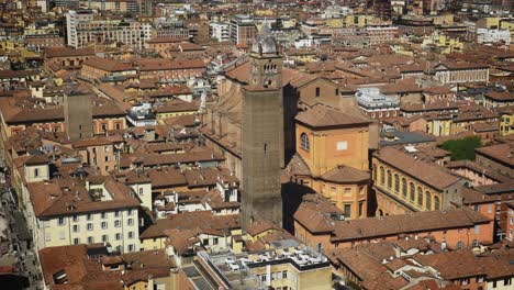 wide aerial view of the bell tower of the cathedral of san pietro in the background of the city of bologna