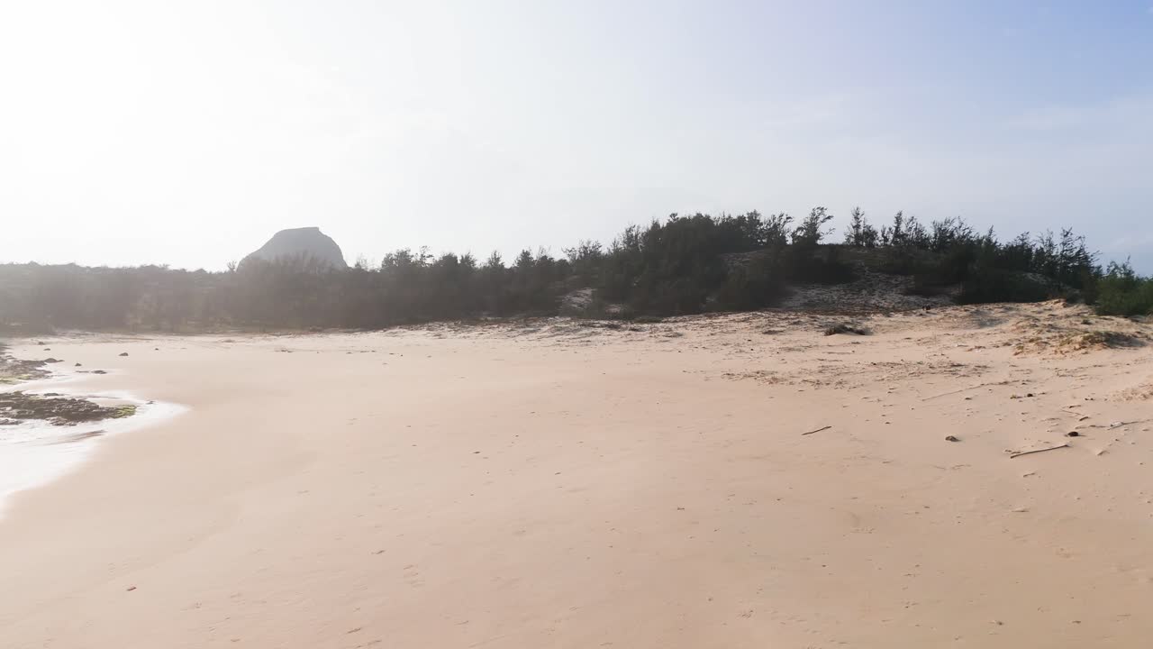 View Pan of Bãi TắM Hòn Choi Beach and the mountain.