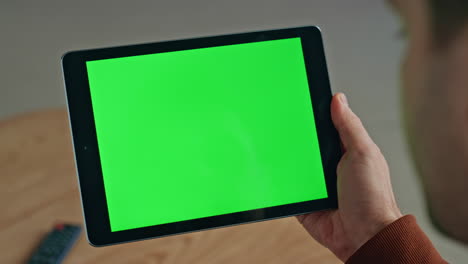 unknown businessman using chroma key tablet for surfing on workplace closeup