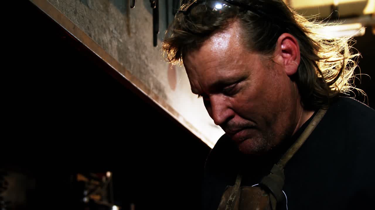 Portrait of blacksmith working