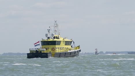 dutch patrol ship on the western scheldt on a windy day