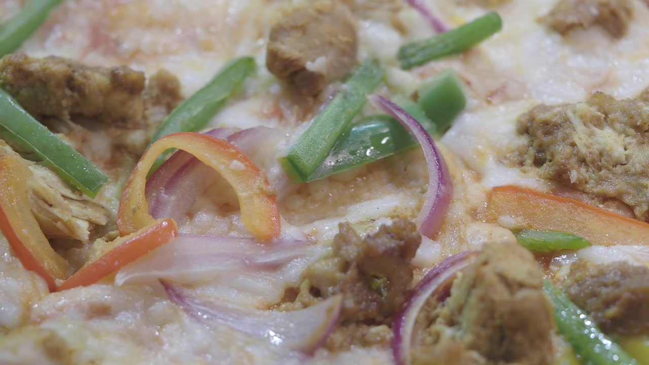 Close-up of a Delicious Pizza with Sausage, Onion, and Peppers