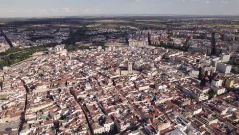 aerial wide view of badajoz cityscape and badajoz cathedral, orbiting shot