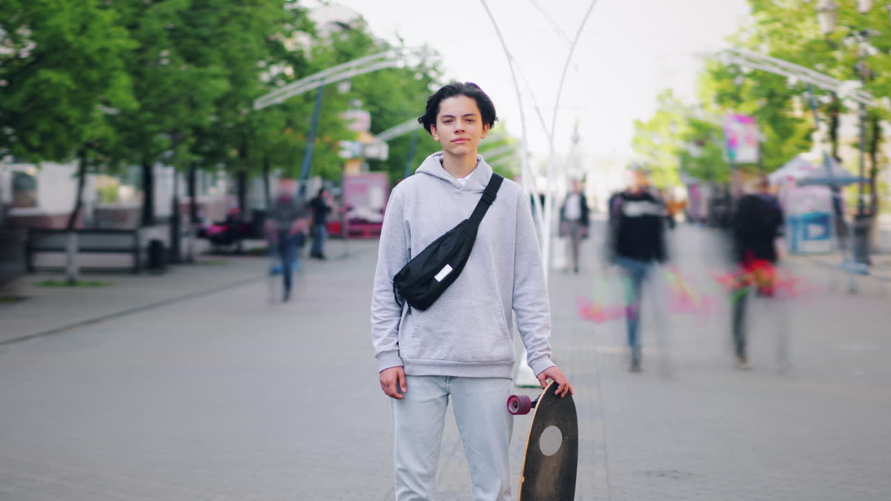 Teenager with a skateboard in the city