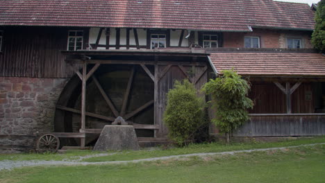 old watermill with a wooden waterwheel