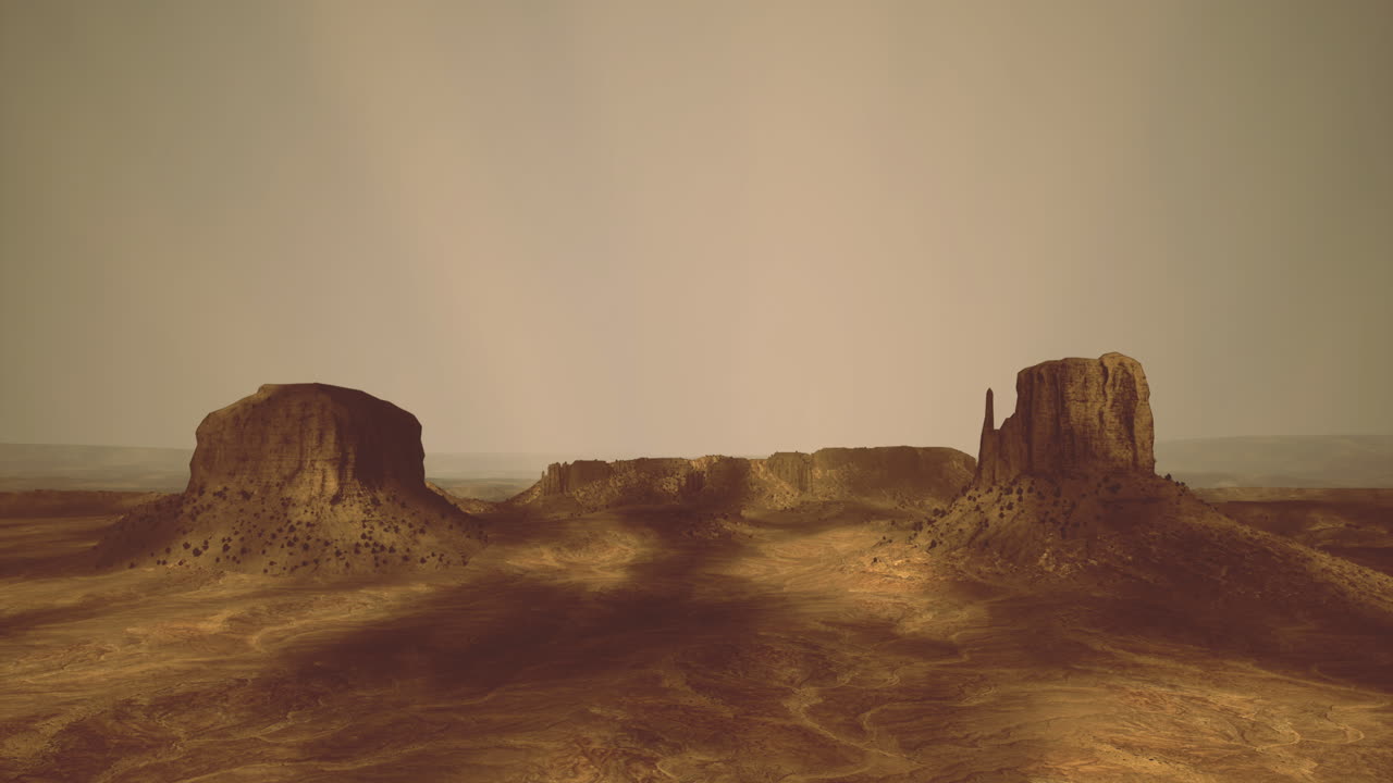 Maestose formazioni rocciose si ergono sul paesaggio desertico durante l'ora d'oro