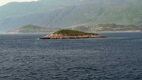 drone aerial shot of the small island in the middle of the sea