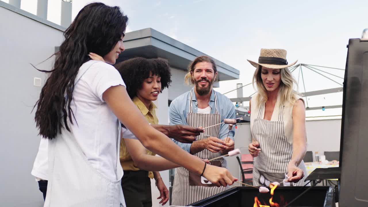 Group of friends having a barbecue on a rooftop