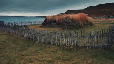 An-ancient-sod-turf-hut-in-the-historic-fishing-village-of-Mortensnes-on-the-shores-Varanger-Norway