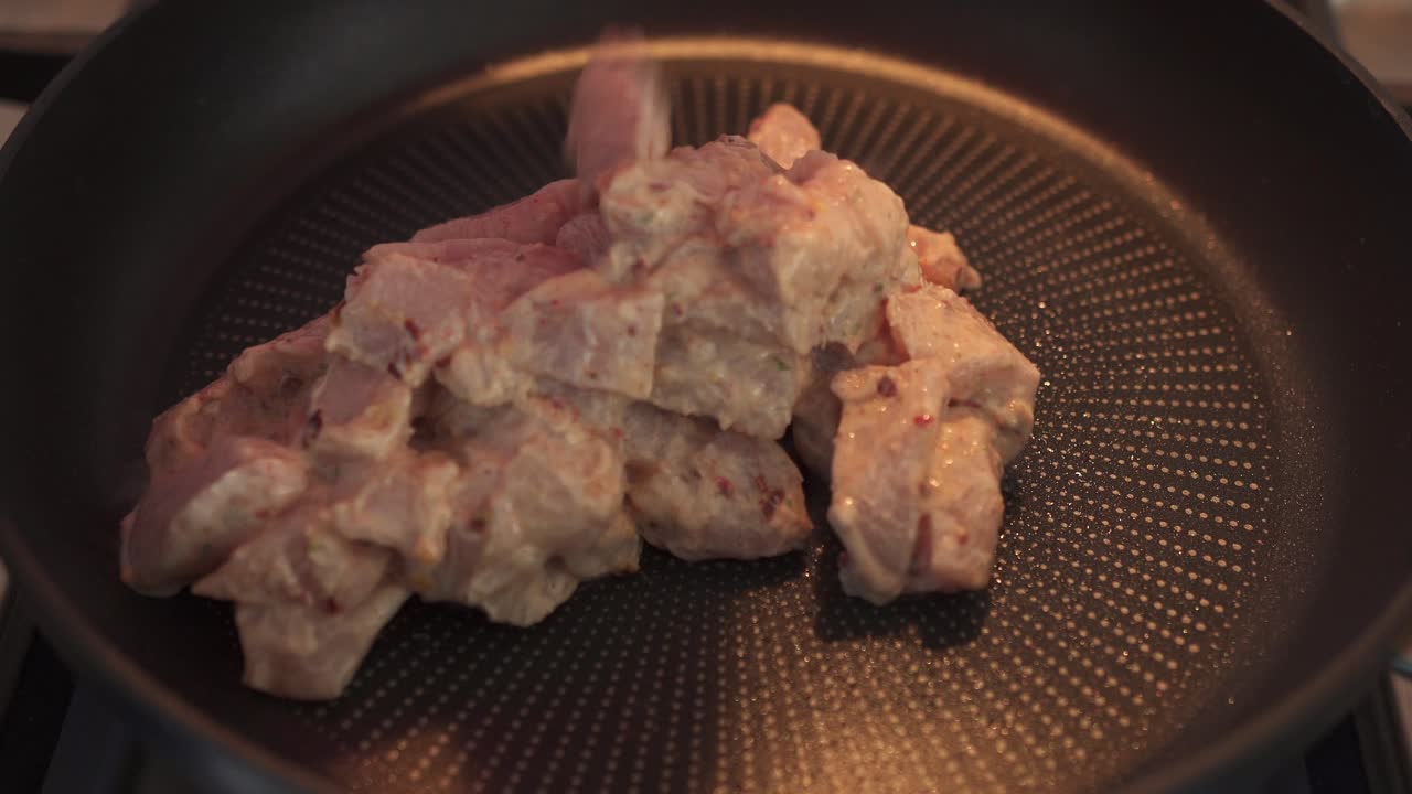 Raw Chicken Being Poured And Stirred In Saucepan