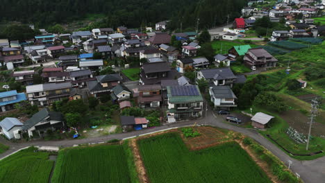 aerial view of rural community houses on the countryside of nagano, japan