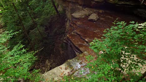 Little-Clifty-Creek-Falls-in-Indiana-low-water-trickling-over-the-edge-static-shot-4K-30FPS