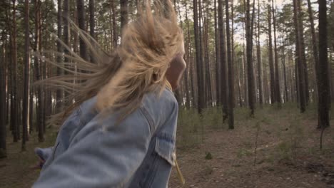 happy girl running in the forest hold friend hand