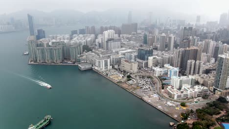 hong kong bay coastline and waterfront skyscrapers, aerial view