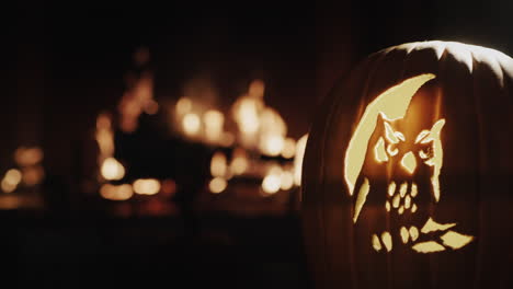 composition with a pumpkin on the background of a fireplace. let's meet halloween