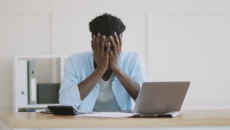 man working on paperwork and finances