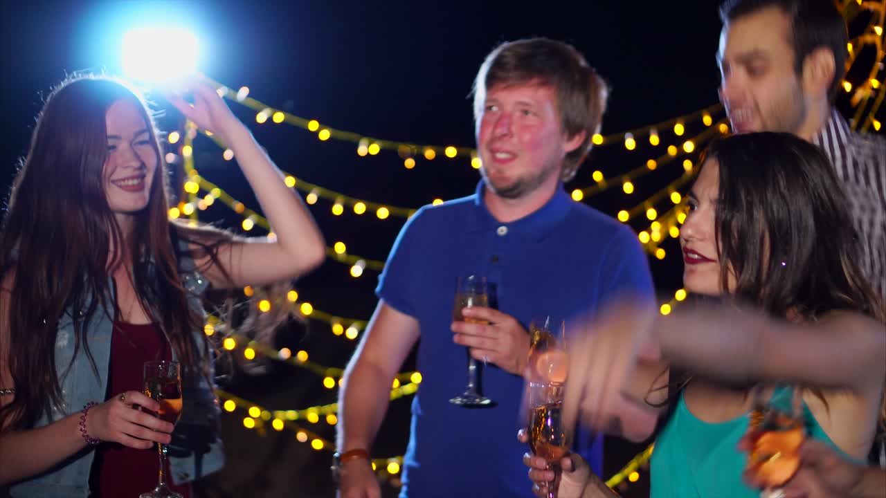 Friends Celebrating at a Nighttime Party