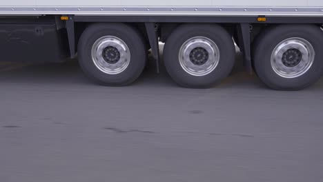 wheels of truck moving on highway.