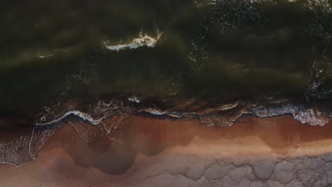 aerial view of a beach and waves