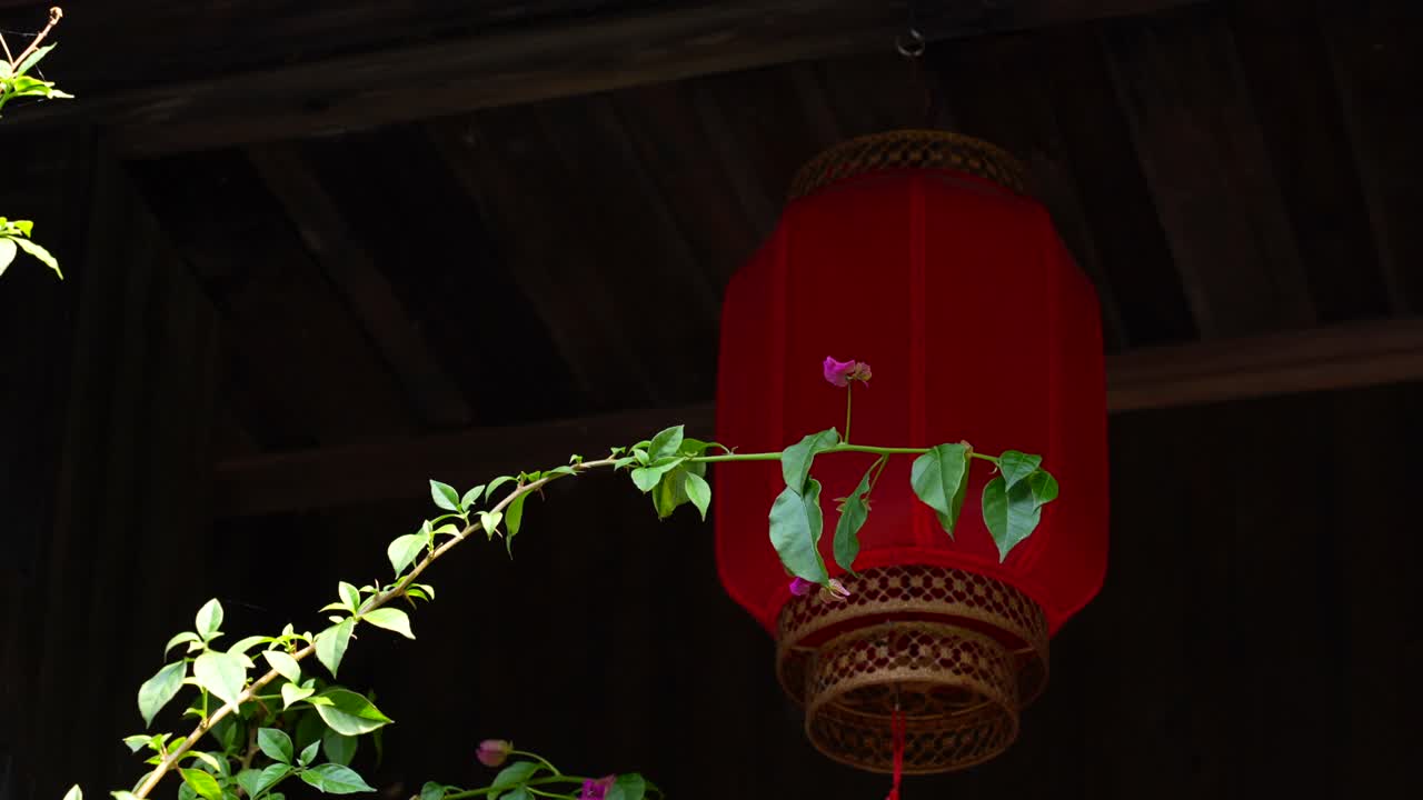 Traditional chinese red lanterns hanging from wooden ceiling. Fenghuang, China