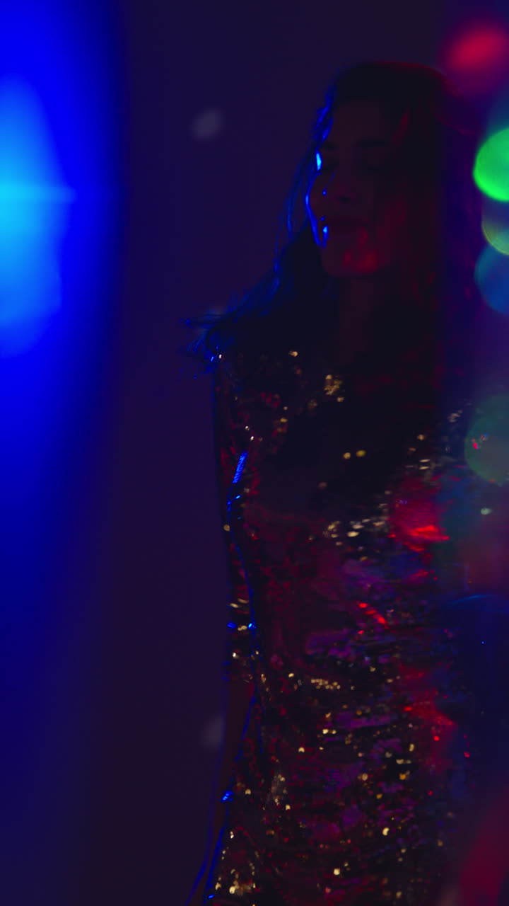 Vertical Video Of Woman In Nightclub Bar Or Disco Dancing With Sparkling Lights In Background 3