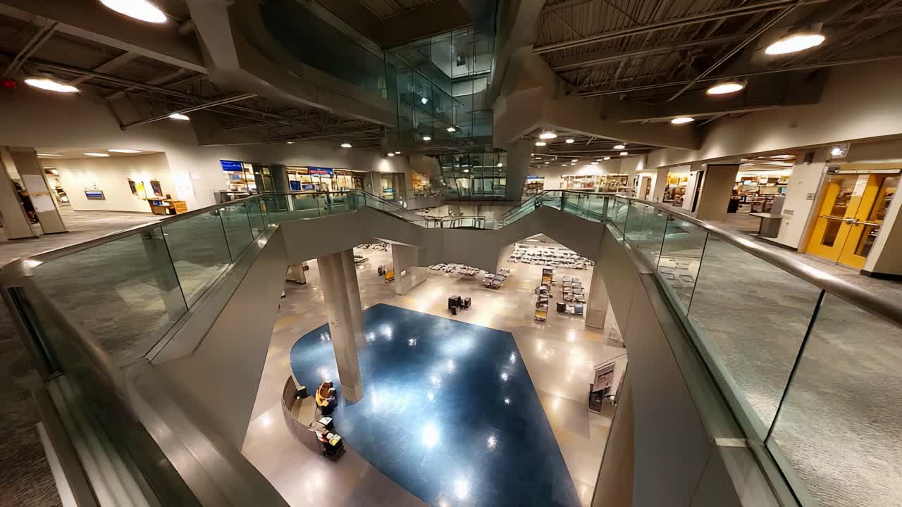 Modern Indoor Architecture Showcasing an Open Layout in a Spacious Facility with Multi-Level Design Elements and Natural Light Streaming Through Panoramic Windows