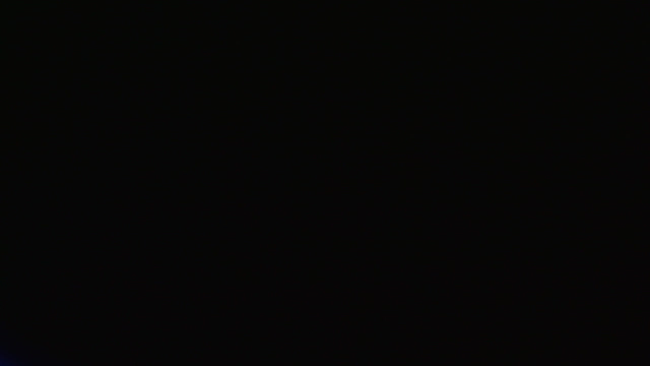 Close-up reveal of a glowing Ukrainian laptop keyboard
