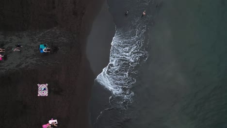 aerial view of a black sand beach in madeira